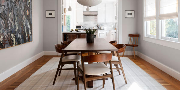 Dining room with plaid area rug